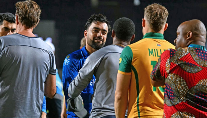 Afghanistans captain Rashid Khan (centre) is consoled by South Africas players after the T20 World Cup semi-final.— AFP/file