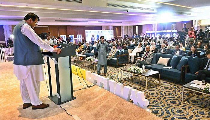 Federal Minister for States & Frontier Regions (SAFRON), Kashmir Affairs and Gilgit-Baltistan Engineer Amir Muqam addressing a seminar on World Refugee Day-2024 organized by UNHCR on June 27, 2024. — APP