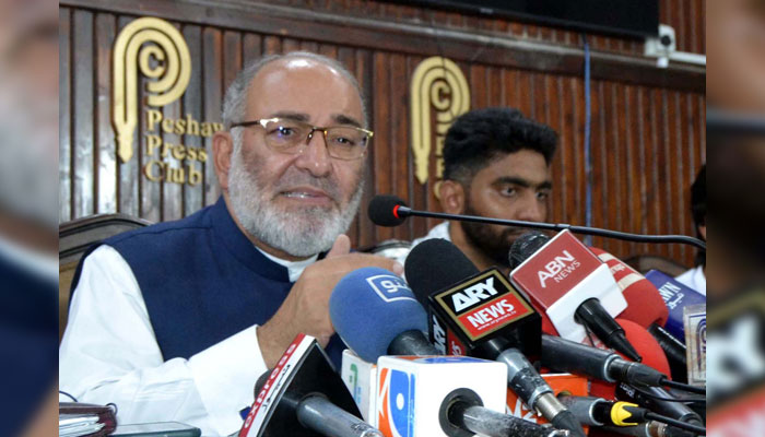 Jamat-e-Islami (JI) leader and former Senator Mushtaq Ahmed Khan addresses media persons during a press conference, at the Peshawar press club on June 30, 2024. — PPI