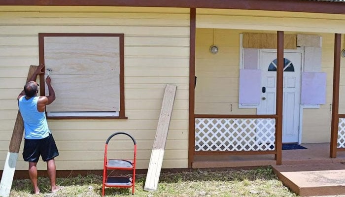 A man boarding up a house ahead of the arrival of Hurricane Beryl in Bridgetown, Barbados, on June 30, 2024. — Reuters