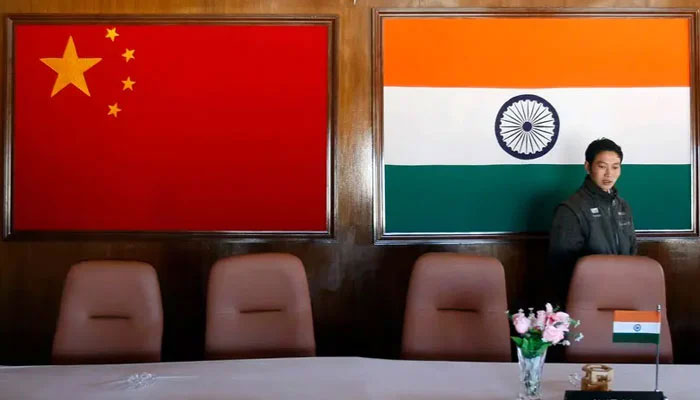 A man walks inside a conference room used for meetings between military commanders of China and India, at the Indian side of the Indo-China border on November 11, 2009. — Reuters