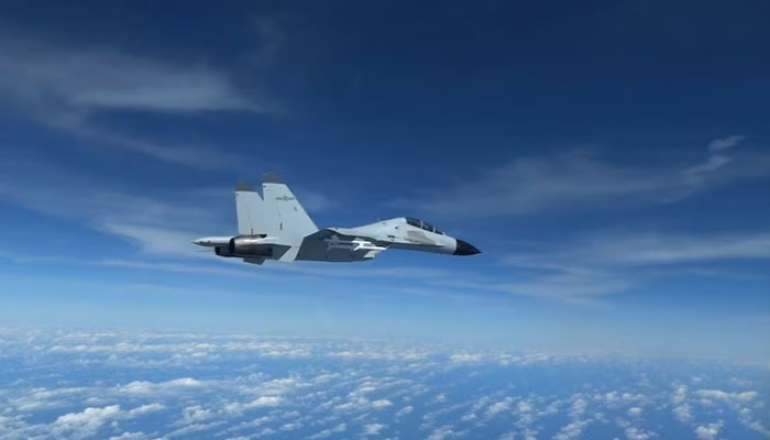 Chinese Navy J-11 fighter jet is recorded flying close to a US Air Force RC-135 aircraft in international airspace over the South China Sea, according to the US military, in a still image from video taken December 21, 2022. — Reuters