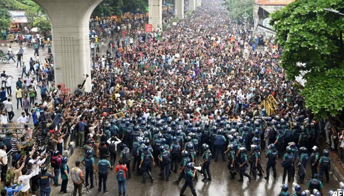 Students scuffle with police during a protest to demand merit-based system for civil service jobs in Dhaka on Jul 11, 2024. — AFP