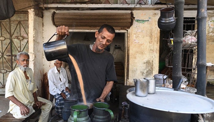 A representational image showing a vendor making tea at his stall in Karachi on September 17, 2018. — AFP