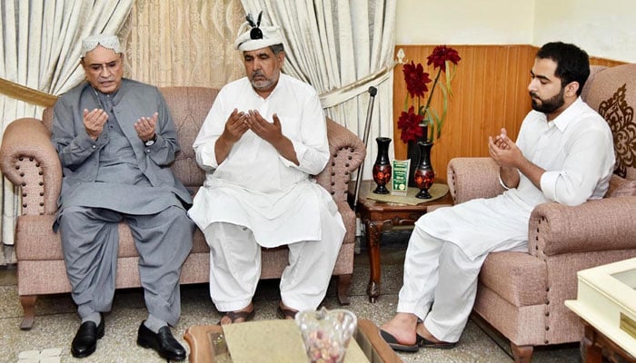President Asif Ali Zardari offers fateha for martyred Captain Muhammad Osama bin Arshad during his visit to the martyrs residence on July 12. 2024. — APP