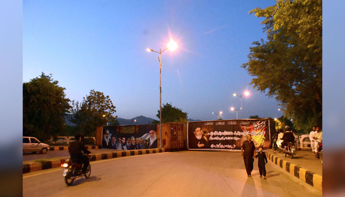 A view of roads blocked with heavy shipping containers at sector G-6 due to 9th Muharram Ul Haram procession in Islamabad on July 15, 2024. — Online