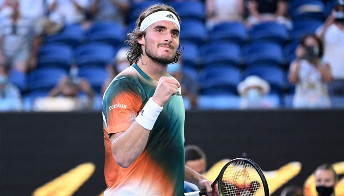 Greeces Stefanos Tsitsipas celebrates winning his third round match against Frances Benoit Paire at Melbourne Park, Melbourne, Australia on January 22, 2022. — Reuters