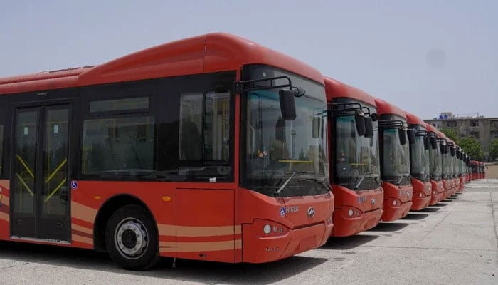 Buses used in the Peoples Bus Service seen in this image. — X@SharjeelInamMemon/File