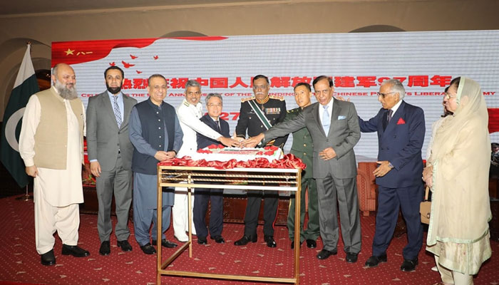Chairman of the Joint Chief of Staff Committee Gen. Sahir Shamshad Mirza (centre) and Chinese Ambassador Jiang Zaidong (centre to left) along with others cut a cake to celebrate the 97th anniversary of the founding of the Chinese People’s Liberation Army (PLA) on July 19, 2024. — Facebook/Pakistan Army