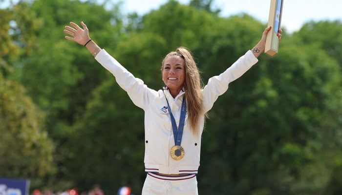 Frances Pauline Ferrand-Prévot reacts after winning the Olympics gold medal in the womens cross-country mountain bike race on July 28, 2024. — AFP