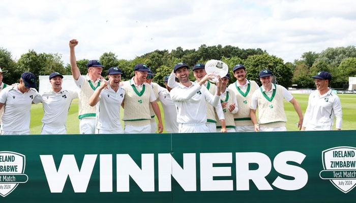Ireland players celebrating with the trophy after their win against Zimbabwe by four wickets in the one-off Test in Belfast on Sunday. — X@Zimbabwecricket/file