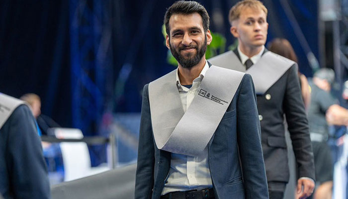 In this handout photograph, taken and released by Real Madrid Graduate School on July 2, 2024, Pakistan’s Imaad Khan gestures during the graduation ceremony at the Santiago Bernabéu Stadium in Madrid. — Instagram@RealMadridGraduateSchool
