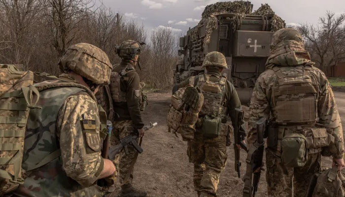 In this representational image, Ukrainian troops on their way towards the front line in Donetsk. — AFP/File