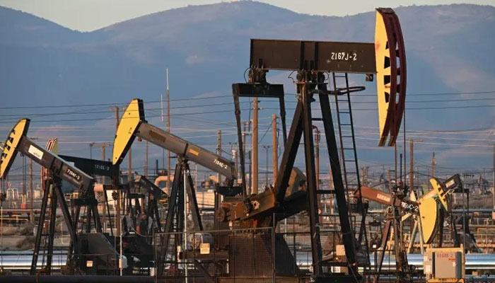 Active pump jacks increase pressure to draw oil toward the surface at the South Belridge Oil Field on February 26, 2022. — AFP