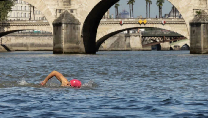 A young man swimming in the river Seine. — AFP/File