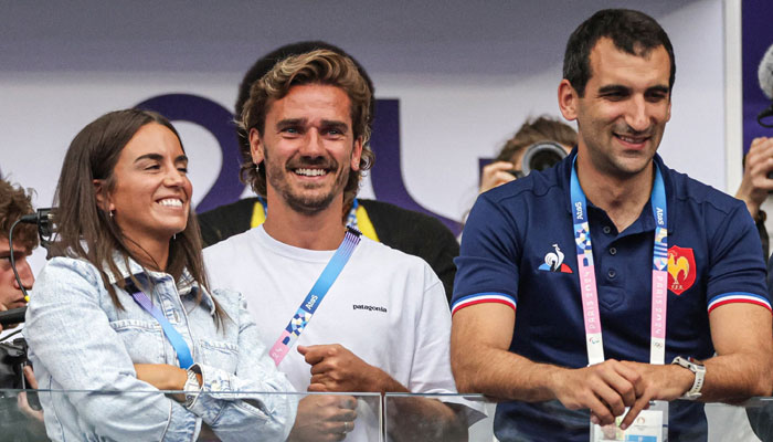 Athletico Madrids French football player Antoine Griezmann (C) and others attend the mens gold medal rugby sevens match during the Paris 2024 Olympic Games in France on July 27, 2024. — AFP