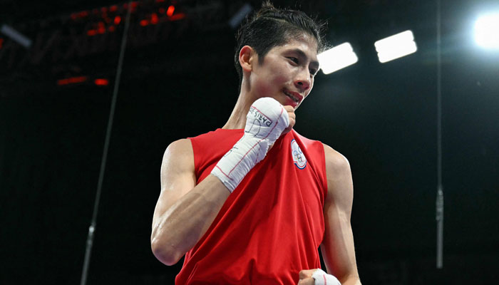 Taiwans Lin Yu-ting reacts after beating Bulgarias Svetlana Kamenova Staneva (not pictured) in the womens 57kg quarter-final boxing match during the Paris 2024 Olympic Games in Villepinte on August 4, 2024. — AFP