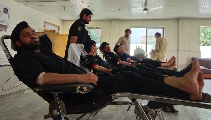 Police officers from Khyber and Karak are donating blood for Thalassemia patients at a blood donation camp organized by Frontier Foundation in Peshawar on August 4, 2024. — Facebook/@frontier.org.pk