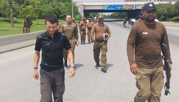 German tourist Berg Florian walking alongside police officials in this undated image. — Geo News/File