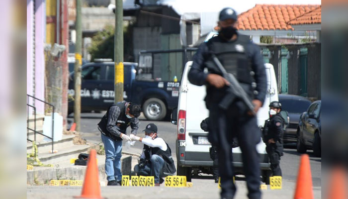 A representational image shows Mexican police personnel standing guard at a crime scene in Mexico on March 19, 2021. — Reuters