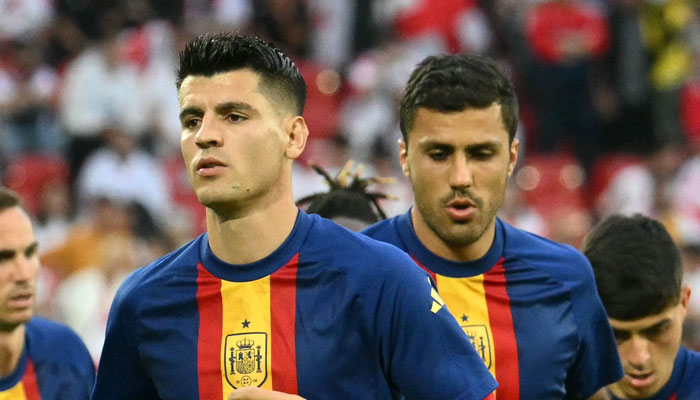 Spains Alvaro Morata (left) and Rodri (right) warm up ahead of the UEFA Euro 2024 round of 16 football match between Spain and Georgia in Cologne on June 30, 2024. — AFP