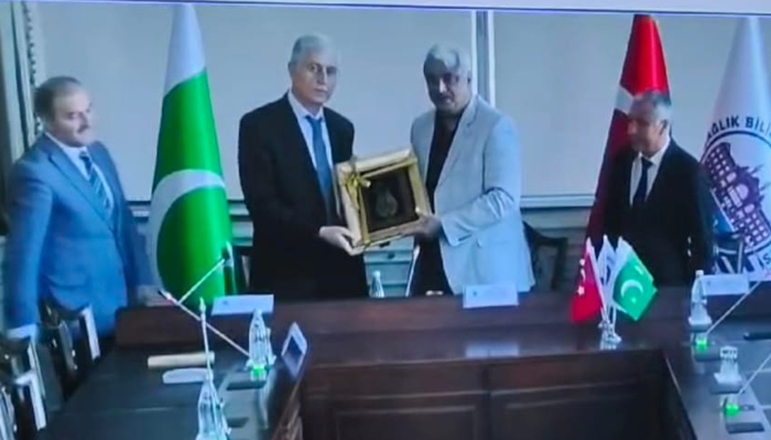 Health Minister Khawaja Salman Rafique is giving the MoU to Secretary General and former Director General Dr. Onar Gunar who came from istanbul, Turkey. Vice Chancellor Prof. Ahsan Waheed Rathore and other present on this occasion. — screengrab-via Facebook/@SalmanRafiquePK/file