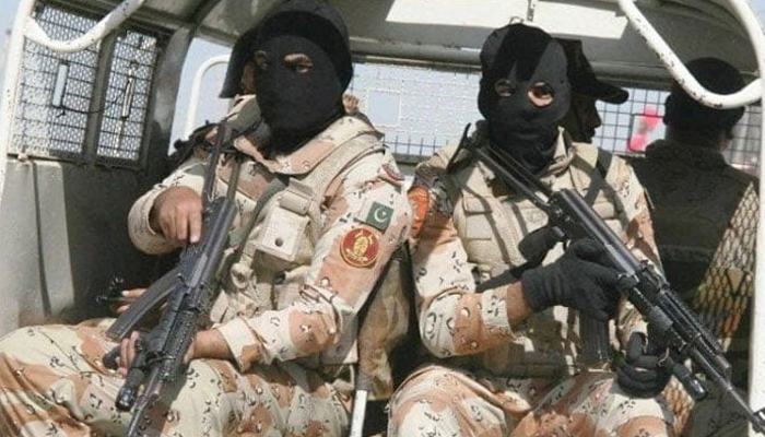 This undated picture shows Sindh Rangers personnel patrolling in an area on a vehicle. — APP/File