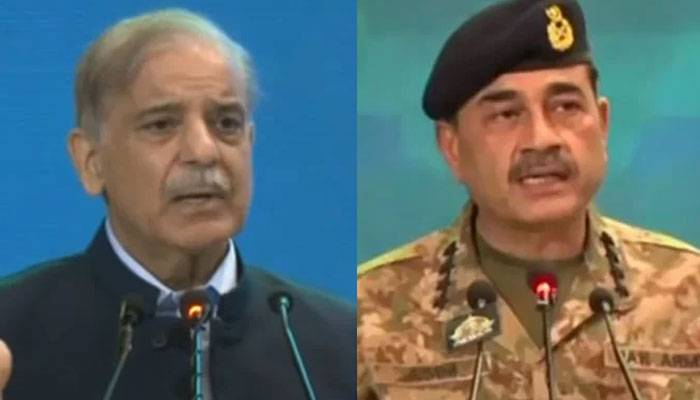 PM Shehbaz Sharif (left) and COAS General Asim Munir (right) talking during Ulema, Mashaikh Conference in Islamabad on August 8, 2024. — Screengrab via Geo News