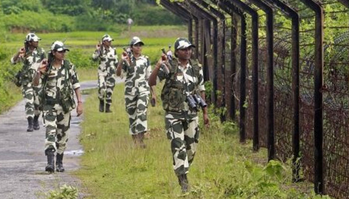 Indias Border Security Force (BSF) personnel patrol along the fencing of the India-Bangladesh international border at Dhanpur village in Tripura. — Reuters/File
