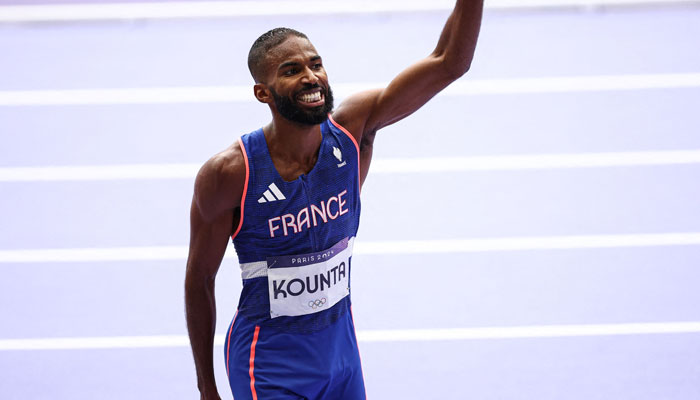 Frances Muhammad Abdallah Kounta celebrate after competing in the mens 4x400m relay heat of the athletics event at the Paris 2024 Olympic Games in Paris, on August 9, 2024. — AFP