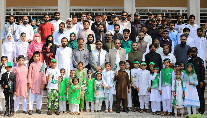 On the occasion of 77th Independence Day of Pakistan Director Academics Prof. Dr. Muhammad Ishtiaq Ali, Director Student Affairs Dr. Amanat Ali, faculty members, staff and children are seen in this group photo on August 14, 2024. — Facebook/@QAUIslamabadofficial