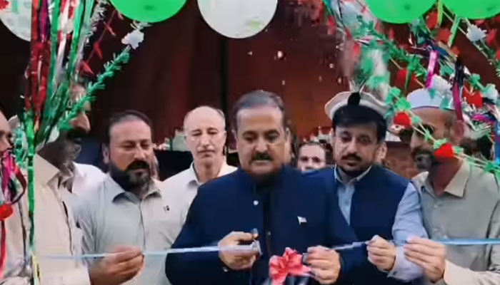 Deputy Commissioner Upper Dir Naveed Akbar cuts a ribbon to inaugurate the All-Pakistan Volleyball Tournament on August 15, 2024. — screengrab via Facebook/Deputy Commissioner Dir Upper