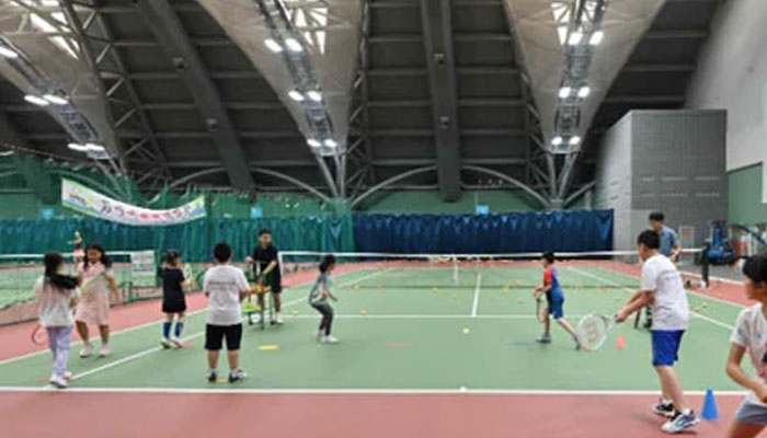 A representational image showing Chinese children during tennis practice at a club in Beijing on August 14, 2024. — AFP