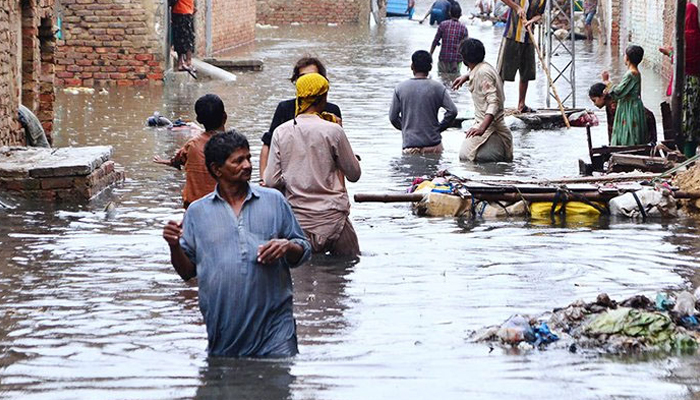 Rain affected people by flash floods after torrential rains hit Hyderabad, on August 2022. — APP