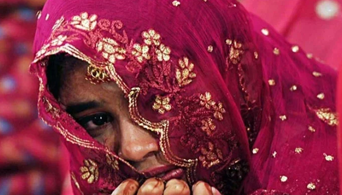 A bride in a mass wedding ceremony in Karachi. — AFP/File