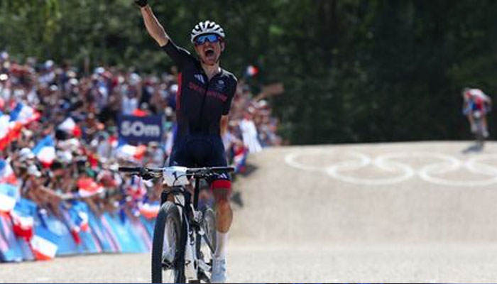 Thomas Pidcock of Britain celebrates after winning gold in the mens cross-country mountain bike event. — Reuters/file