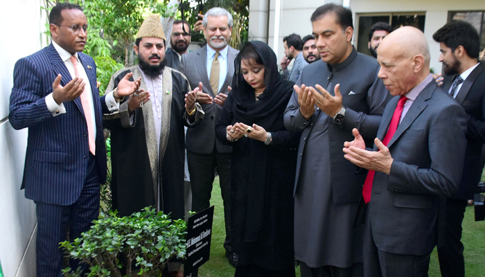 Minister for Climate Change Romina Khurshid Alam (centre), Ethiopian Ambassador to Pakistan Jemal Beker (1st from left) and Chairman CDA Muhammad Ali Randhawa and other offering pray after planting ceremony in embassy of Ethiopia Islamabad on August 24, 2024. — Online