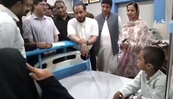 Health Minister Kh Imran Nazeer speaks with patients during his visit to Muridke THQ Hospital on August 25, 2024. — Screengrab via Facebook/Primary & Secondary Healthcare Department