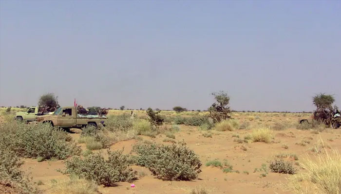 Fighters from the Tuareg separatist rebel group MNLA drive in the desert near Tabankort, February 15, 2015. — Reuters