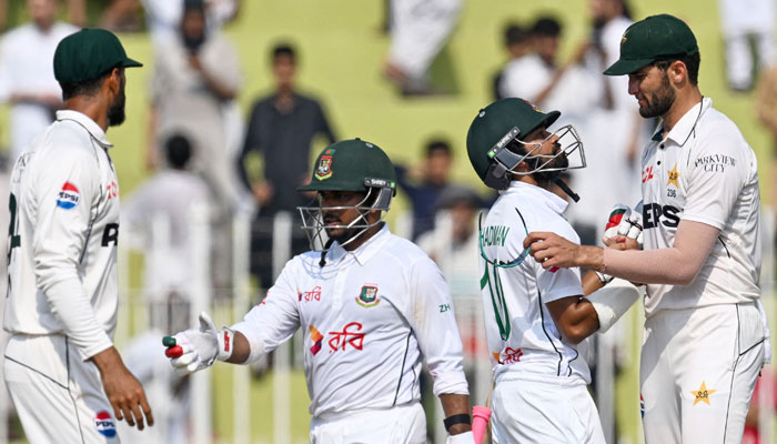 Bangladeshs Shadman Islam (2R) and Zakir Hasan (2L) greet Pakistans players after their teams win at the first Test cricket match between Pakistan and Bangladesh in Rawalpindi on August 25, 2024. — AFP