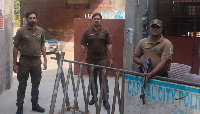 Punjab police personnel stand alert in this photo.— Facebook/DIG Ops Lahore Police/File