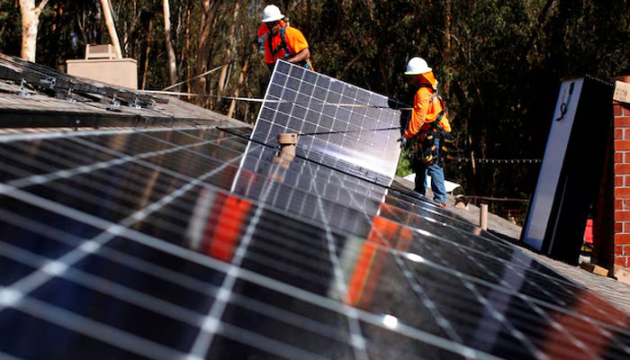 Solar installers from Baker Electric place solar panels on the roof of a residential home in Scripps Ranch, San Diego, California, U.S. — Reuters/File