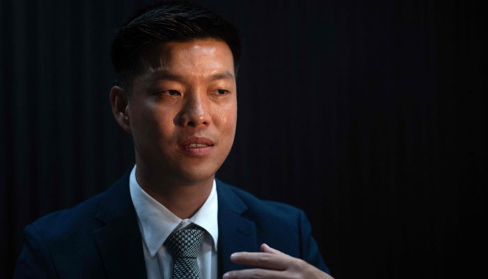 Natthaphong Ruengpanyawut, leader of the relaunched Thai opposition Peoples Party (PP), gestures during an interview with AFP in Bangkok on August 28, 2024. — AFP