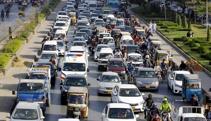 Large numbers of vehicles are seen stuck in a traffic jam at Main Korangi road in Karachi on February 19, 2024. — PPI