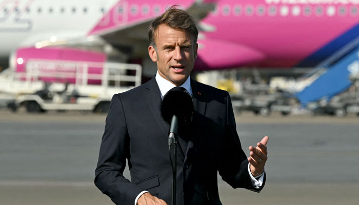 Frances President Emmanuel Macron addresses a speech to the media on the Nikola Tesla Belgrade international airport tarmac in Belgrade on August 30, 2024. — AFP