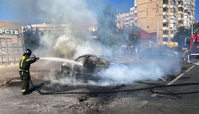 This image shows a firefighter extinguishing a car after a recent shelling by a Ukrainian strike in Belgorod on September 1, 2024. — AFP