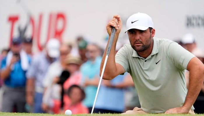 Scottie Scheffler lines up his putt on the fifth green during the final round of the TOUR Championship golf tournament. — USA TODAY Sports/file