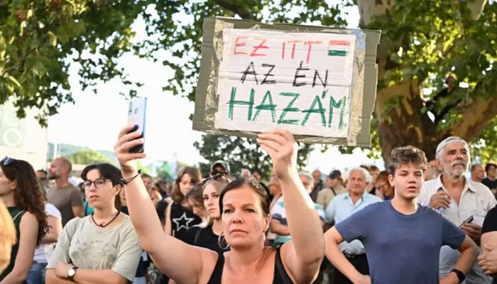 A demonstrator holds a banner reading Heres my homeland as teachers, students and their sympathisers protest in central Budapest at the headquarters of the Interior Ministry on September 2, 2024. — AFP