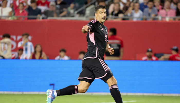 Luis Suarez (9) celebrates after scoring a goal against Chicago Fire FC in the second half at Soldier Field. — USA TODAY Sports
