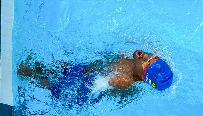 Gabriel Geraldo dos Santos Araujo, known as Gabrielzinho, takes the crowds applause after receiving his third swimming gold medal of the Paris Paralympics. — AFP/file